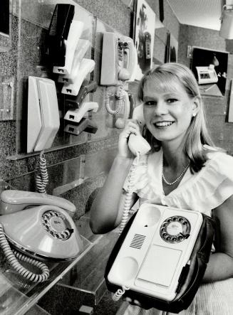 Talk shopping: At a Bell Canada Phonecentre Suzane Edwards shows that her employer sells and rents numerous types of exotic telephones