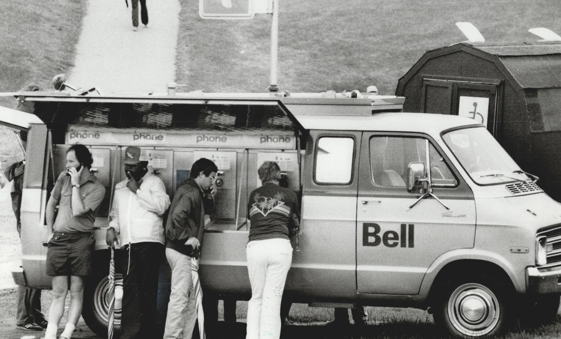 Bell telephone thinks of everything - including portable phone booths for Open spectators