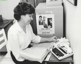Break for the deaf: Wilma Kracko of Missisauga, deaf since she was 7, is making a call using Bell Canada's new relay service