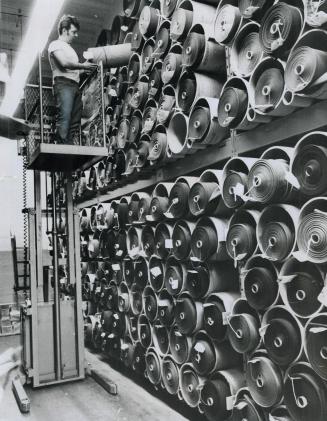Suiting Materials are sponged and steamed for pre-shrinking, then inspected for flaws before re-rolling into bolts to await manufacture into garments