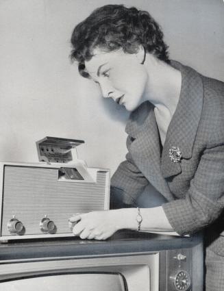 This is what the telemeter TV unit looks like, Sandra Shaw selects new movie she wants to see