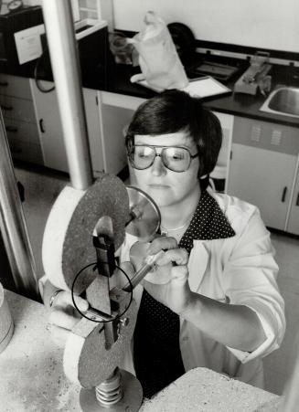 Tough test: Eva Muniak uses special machines in Eaton's product research lab to help take the guesswork out of buying children's wear by testing fabrics for durability, strength and comfort