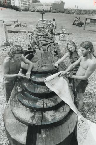 Shaping up, Members of the Ne Chi Zu Guild of Vancouver are carving a cosmic maypole out of a 50-foot red cedar log, 5 feet in diameter, at Harbourfront's Bathurst Quay