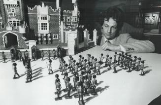 Changing the guard: David Tyrer, toy specialist with Phillips Ward-Price, changes the guard in front of a model of Casa Loma