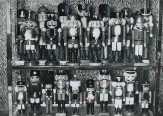 Brightly painted nutcrackers stand at strict attention