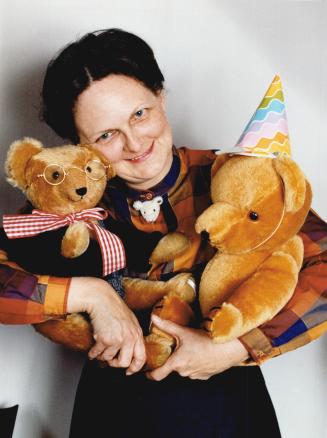Teddy bear mania grips Willowdale, Ruth Fraser, president of the Bearly Ours Club, poses with some of her teddy bears