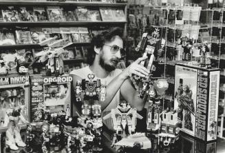 Superior quality: Silver Snail owner Ron Van Leeuwen is surrounded by the transformer toys he imports from Japan