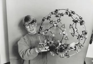 World in his hands: David Dickinson, 13, holds a Googolplex globe constructed of geometric shapes