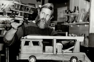 Movable feats: Jim Smith creates toys with wood, specializing in movable trucks, trains, planes and children's riding toys