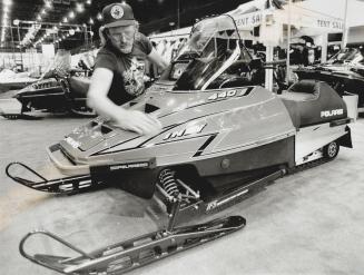 Warming up for the white stuff, Fred de Boer puts a sheen on a showmobile at the Toronto International Snowmobile and ATV Show. The four-day event ope(...)