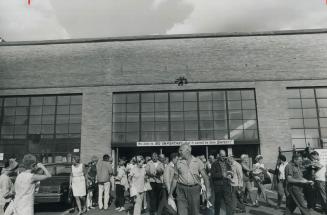 Workers pour out of General Motors Frigidaire plant at end of shift yesterday after being told the company is getting out of the household appliance i(...)