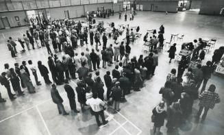The Jobless line up for Unemployment Insurance cheques today in Moss Park Armory, one of two places where the cheques are being distributed while mail(...)