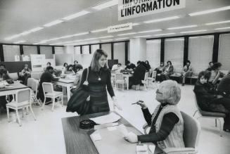 Marie Grenier, 20, gets information on how to try to get a job from Gertrude Blitzstein, Canada Manpower receptionist in Toronto Dominion Centre. Wome(...)
