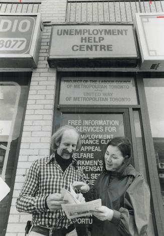 Counsellors to the unemployed, Keith Oleksink and Barbara Linds discuss a problem outside the Unemployment Help Centre where they work. The centre hel(...)