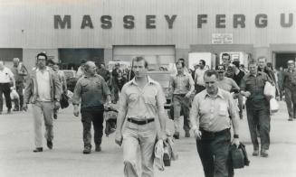 Extra protection: Labor minister Robert Elgie has made proposals to help workers being laid off, like these ones leaving Massey-Ferguson last spring for a long, jobless summer