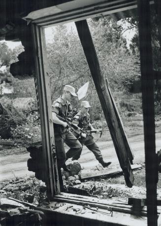 L-R Priv. Joel Langlois, (Port Daniel, P.Q.) and corpl. Benoit Champagne, (Asbestos, P.Q.) Patroling Bufer Zone at Nicosia, Cypress