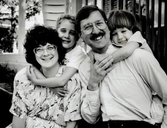 Tom Magyarody, with his wife, Krista, and duaghters Nora, 6, (left) and Kathy, 4