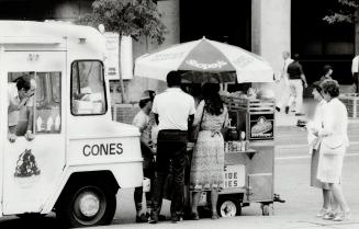 All The Rage: While storekeepers and politicians fume, passersby line up to buy hot dogs from vending carts that may pull in as much as $2,000 a day each