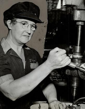 Mrs. Charlotte Hussey is a comparative newcomer to the plant, but already is working an intricate drill. She has a daughter overseas with the R.C.A.F. (W.D.)