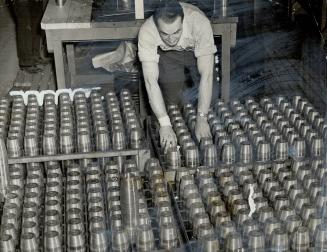 Thousands of men make thousands of the tools of war in Welland's factories