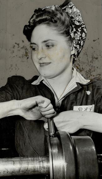 Operator of a turret lathe in the plant of Research Enterprises, Ann Haladay, 26, of Browning Ave
