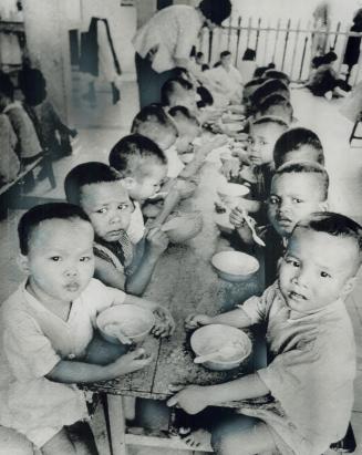 A small bowl of rice is a meal for the 1,245 childen in the Govap Orphanage in Saigon, where some have legs as thin as a man's thumb and the children (...)