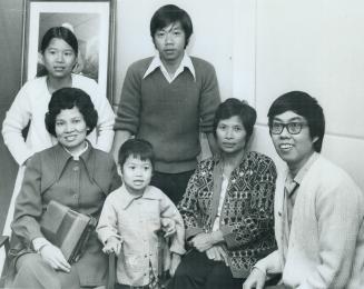 Standing, left to right, Anh Dao, 14, and Hoang Nhan, 20