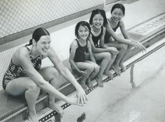 The Duc sisters, Caroline, 8, Justine, 11, and Christine, 13, take swimming lessons at Lord Dufferin School