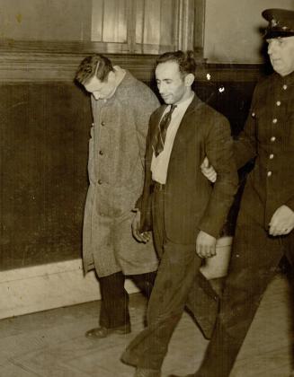 Charged with transporting five German prisoners of war, Isaac Kathnelson, 35, is shown next to P