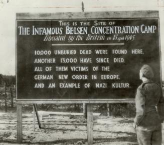 Germans are reminded of their barbarous cruelty in this sign-one of two which mark site of now-destroyed Belsen horror camp. The other is written in German