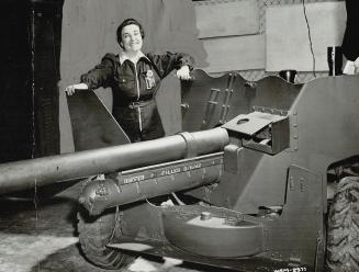 Chosen as mother of the year and a model worker in the large Canadian gun arsenal where she works, Mrs