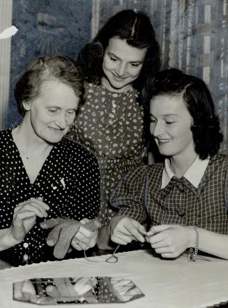 Cotton clothing is the order of the day for these Canadian girls working in war plants