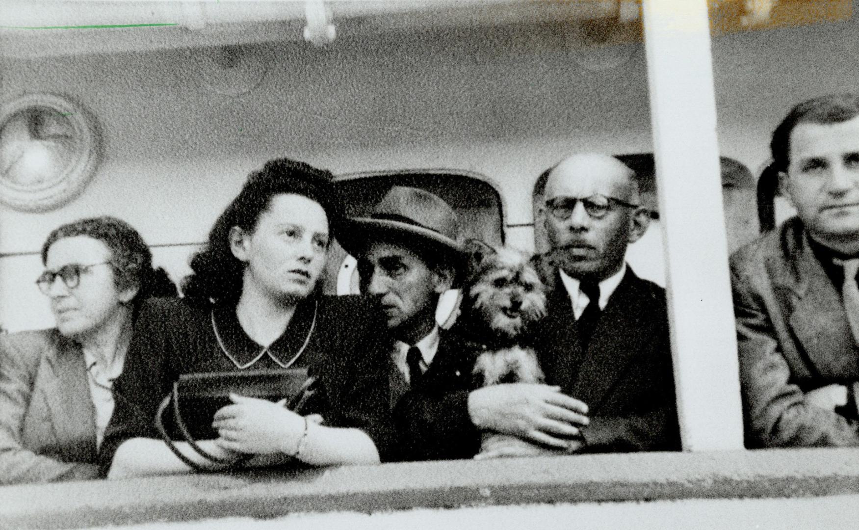 Looking back: Nellie Frajermauer, left, friend Allen Seidlitz, dog Teddy, Nellie's father Jacob and Albert Lichter, whom Nellie would marry in Canada, before leaving Portugal