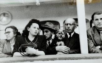 Looking back: Nellie Frajermauer, left, friend Allen Seidlitz, dog Teddy, Nellie's father Jacob and Albert Lichter, whom Nellie would marry in Canada, before leaving Portugal