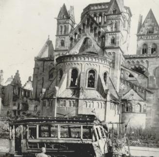 Wreckage in Coblenz, German city at the juction of the Rhine and Moselle rivers, is viewed here by a G