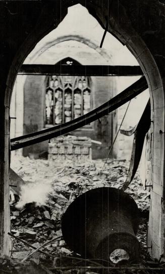 The bells of St. Mary, in Swansea, crashed from the steeple and fell into the ruined interior, after a recent savage air raid. The churches in the Bri(...)
