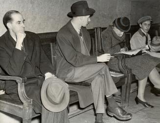 Spy suspects, seated well apart, await developments in the preliminary trial of Fred Rose, Labor Progressive M
