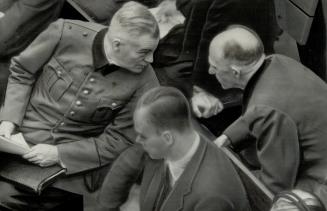 Two Top War Criminals on trial at Nuremberg, Germany, discuss a phase of the proceedings