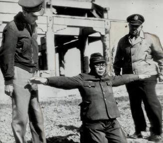 Death came to three Doolittle fliers with their hands tied to crosses before they were shot as demonstrated by this Japanese warrant officer