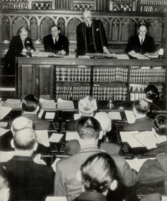 First session of the United Nations war crimes commission gets under way in London with an address by the chairman, Lord Wright, standing centre. Sixteen nations are represented