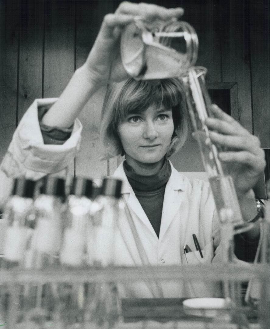 Testing the waters, Chemist Tatiana Terekhova analyzes a water sample for Fisher Assoc