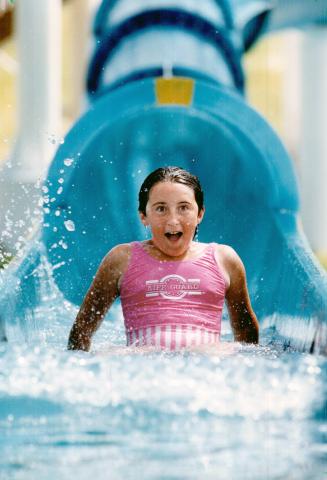 Plenty to gush about in Brampton, A sure way to get refreshed in a hurry is doing what Lisa Maher, 12, is doing - making a splash landing on the water(...)