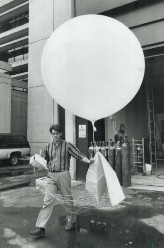 Gone with the wind? Meteorologist at Pearson International Airport prepares to launch weather balloon, a system that may soon be obsolete for wind measurements