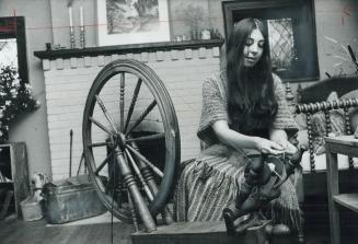 Lucille Hefford spins wool on this family wheel from Quebec
