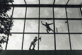 Reflections of a window washer, Making the most of this week's Indian Summer weather yesterday, Mike Green, right, and a co-worker from the Heinz Brei(...)
