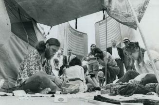 Grass roots grows a 'Wacheea' at City Hall, Members of Grass Roots, the organization trying to set up a tent city for transient youth this summer, do (...)
