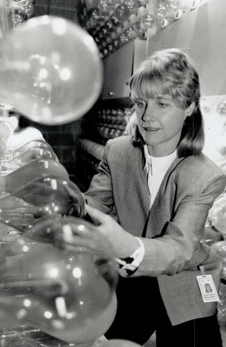 Carol Shorrock, top right, inspects light fixtures