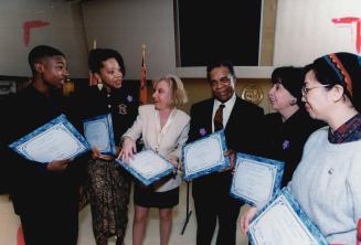 Award winners: Posing with awards after a ceremony are, from left, student Jason Bogle, who accepted for Joe Destine, Karen Warner, Melanie Beck, Andrew McLeod, Vincy Angelone and Christina Lo