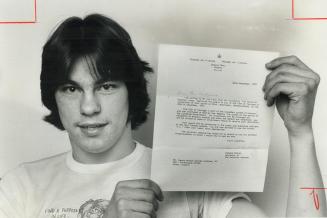 Denny Andrews, 18, shows award