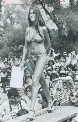 Winning figure: The long-legged; 36-24-34 beauty of Louise Lowry added up to No. 1 in this year's Miss Bikini contest at Toronto Island's holiday-weekend picnic